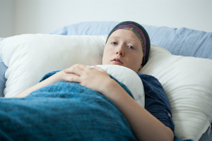 woman headscarf hospital bed