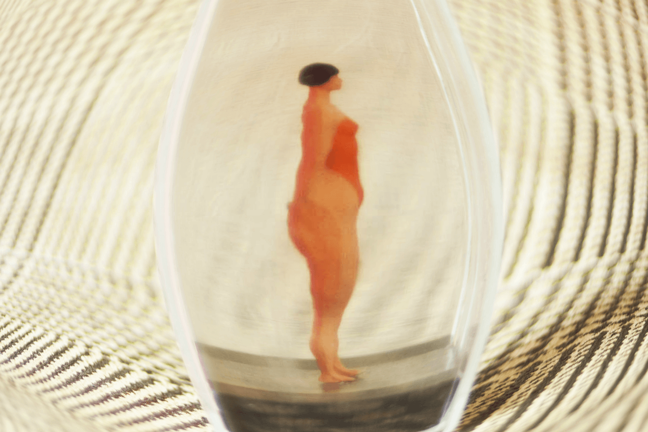 female doll in glass jar