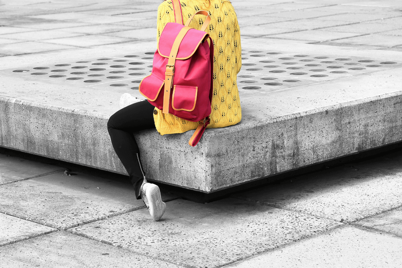 LGBTQ college student yellow shirt red backpack