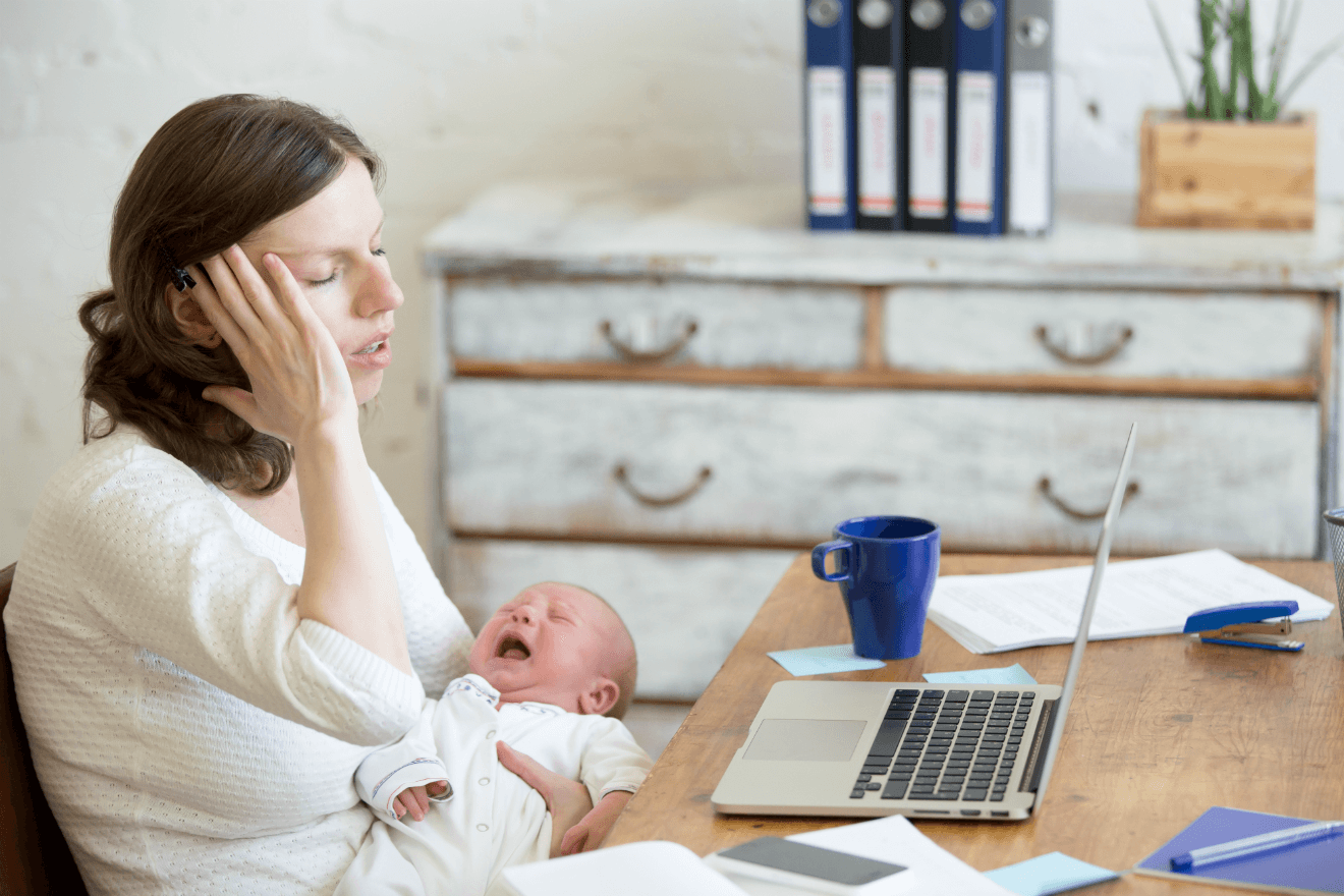 mom stressed baby crying desk